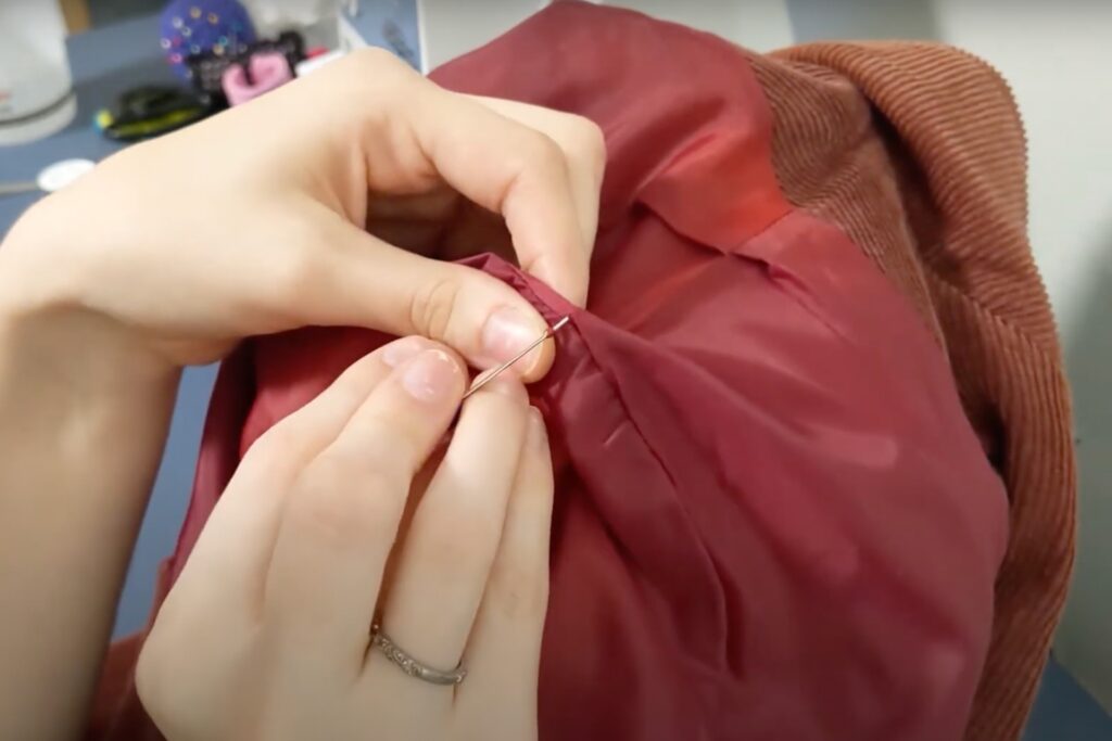 Removing a sewn shoulder pad