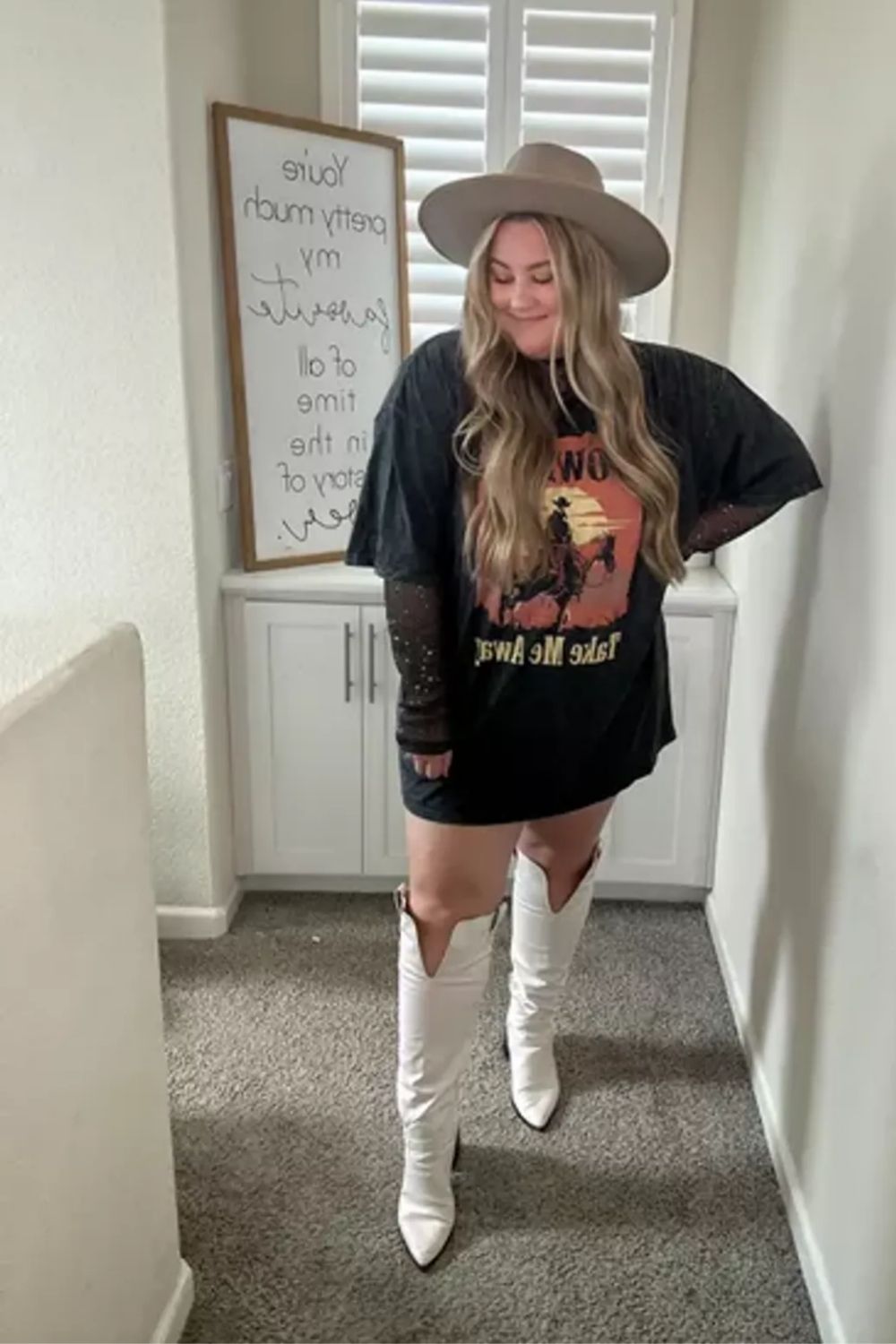T-shirt dress, high white boots, hat create a trendy, laid-back look.